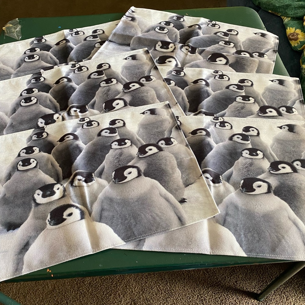 Six penguin placemats